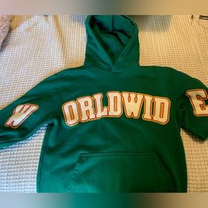 Green jacket front says “Worldwide”